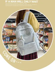 Zaino blu chiaro con motivo a stelle, scomparti multipli e grande capacità per scuola e viaggi.