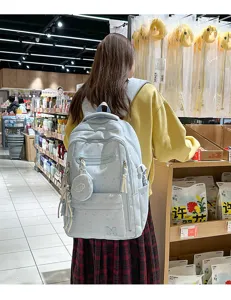 Zaino scolastico blu leggero con stampa di stelle, scomparti multipli e tasca frontale per studenti.