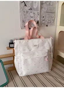 Cute soft girl star print canvas backpack detail, featuring spacious pockets and pink straps.