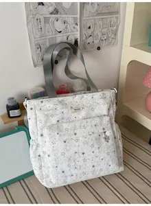 Casual canvas tote bag with star print, large capacity multi-pocket shoulder bag for students.