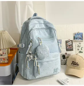 Zaino azzurro con stampa di stelle, scomparti multipli e grande capacità per la scuola.