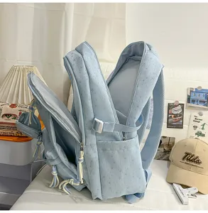 Zaino azzurro con stampa di stelle, multi-comparto per la scuola, viaggi e tempo libero.