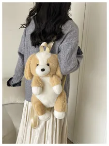 Adorable petit sac à dos chiot en peluche pour enfants, design bicolore marron et blanc.