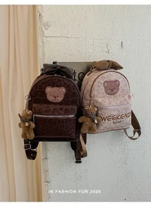 Cute leopard print PU backpack featuring cute bear embroidery, bow decor and plush pendant for women.