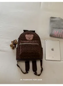 Leopard print PU leather backpack with cute bear patch and charm for women daily commute.