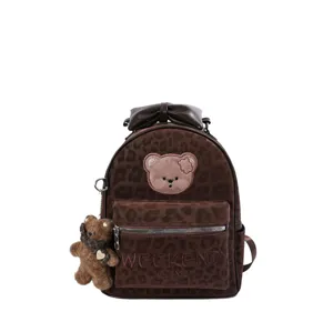 Fashion cute leopard print PU leather backpack for women, stylish travel school bag.