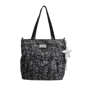 Canvas star print tote bag detail showing front pocket and cute hanging plush star charm.
