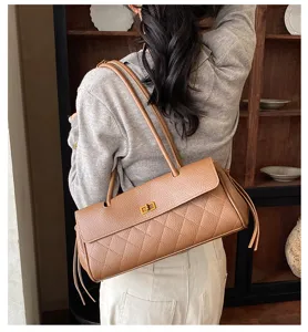 Vintage PU leather quilted shoulder bag for women, stylish horizontal tote with turn-lock.