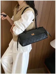 Detail view of the elegant black quilted PU leather shoulder bag featuring chic gold turn-lock.