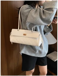 White quilted shoulder bag with turn lock and double straps, stylish PU leather crossbody.