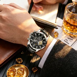 Detail view of automatic mechanical men watch with black dial, Roman numerals and leather strap.