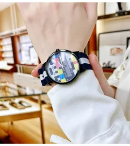 Trendy quartz watch with colorful TV test pattern dial and stylish blue white nylon strap.
