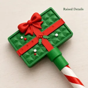 Christmas credit card wand detail showing raised gift box details with red bow design.
