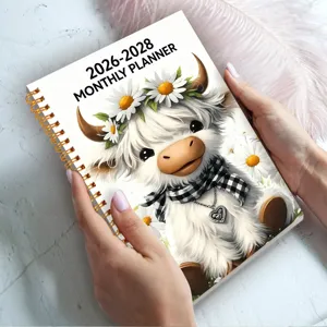 Cute 2026-2028 monthly planner notebook with adorable highland cow and daisy cover design.
