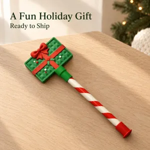 Detail shot of Christmas gift wand prop, candy cane handle design, festive holiday decor.