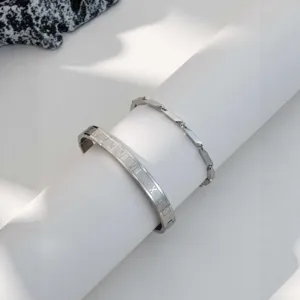 Stainless steel Roman numeral cuff and chain bracelet set, high-end fashion jewelry.