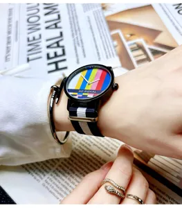 Trendy quartz watch with colorful tv test pattern dial and canvas strap for men and women.