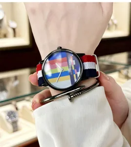 Close-up detail shot of the colorful TV test pattern dial quartz watch with NATO strap.