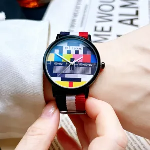 Trendy quartz watch with color TV test pattern dial and red white blue canvas strap for men.
