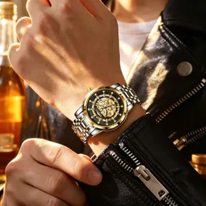 Men's automatic mechanical watch with two-tone stainless steel strap and skeleton dial.