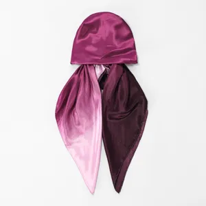 Detail view of the satin gradient headscarf bonnet, showcasing smooth texture and elegant drape.