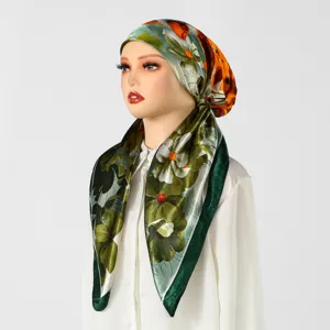 Green floral satin headscarf detail, elegant women wrap cap for versatile styling.