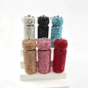 Rhinestone bling sub-bottling bottle keychain pendant, creative sparkling car bag hanging accessory.