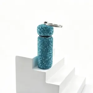 Detail view of the sparkly rhinestone mini sub-packaging bottle keychain, stylish bag charm.