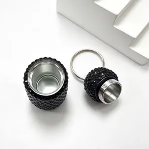 Detailed view of a stylish black rhinestone mini sub-bottle keychain and bag pendant.