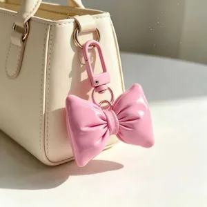 Rosa PU Leder gepolsterte Schleife Schlüsselanhänger für Handtasche, süßes Accessoire.