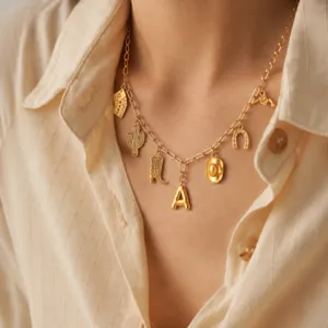 Western cowboy style gold charm necklace with cute playing card cactus boot and horseshoe pendants.