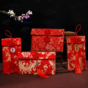 Traditionelle chinesische Brokat-Geldbeutel mit Quasten fuer festliche Hochzeitsgeschenke.