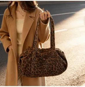 Detailed view of a chic leopard print shoulder bag, perfect for daily casual commuting.