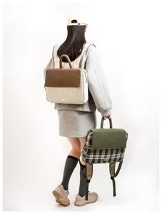 Stylish college style laptop backpack with flap closure and top handle, durable daily use.