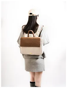 Casual canvas laptop backpack for students, stylish striped book bag with brown flap.