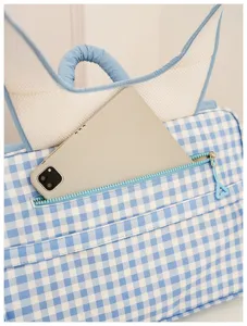 Blue and white gingham laptop backpack detail, student school bag with front pocket.