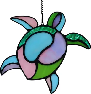 Detailed close-up view of the colorful stained glass sea turtle suncatcher ornament.