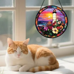Stained glass window hanging suncatcher featuring lighthouse and floral sunset design detail.