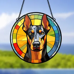 Close-up detail of colorful Doberman pinscher stained acrylic hanging wall ornament.
