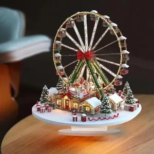 Detailed view of Christmas Ferris wheel village ornament with LED lights and snow decor.