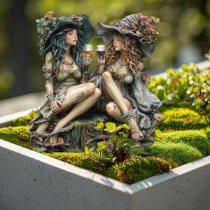 Detailed view of fantasy magic elf figurine couple resin garden ornament decor for outdoor patio.