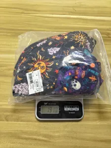 Quilted Halloween witch magic hat with digital print starry skull pattern, bagged detail.