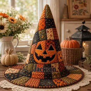 Close-up of quilted Halloween witch hat featuring pumpkin face and custom Jackson embroidery.