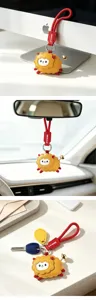 Cute cartoon sheep car pendant keychain, red leather strap and spring design for new year gift.