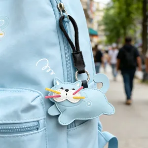 Cute blue cat plush PU leather bag charm and keychain pendant with colorful whiskers for backpacks.