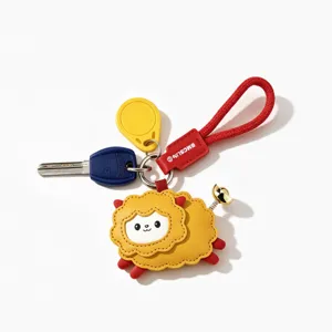 Cute yellow sheep leather keychain with red strap, perfect car key accessory and gift.