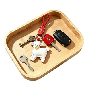 Cute white leather lamb keychain set with red strap and metal keys for daily gift use