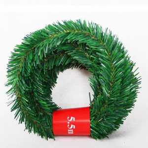Detail shot of the 5.5m green Christmas tinsel garland, showing the dense pine needle texture.