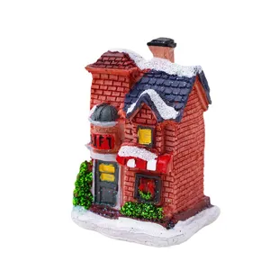 Statuetta casa luminosa in resina di natale decorazione tavola design mattone neve.