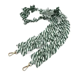Green white striped scrunchie phone lanyard strap detailed view of fabric and metal clasps